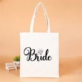 White canvas tote bag with black Bride script and diamond graphic for bridal parties - Bride Diamond Logo
