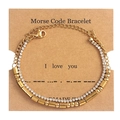 Detailed view of Morse Code double-layer gold bracelet with crystals on display card - I Love You Gold