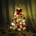 Detail of decorated mini Christmas tree with festive ornaments and warm LED lights - 30cm White Tree with Accessories and 2x Battery Warm White Light