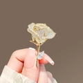 Golden wheat-shaped rose brooch with sparkling crystals held in hand for detail - 452# Rose