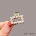 Mini golden metal hair claw with white pearls, size 2.5cm, shown held by fingers - 1# Square Pearl