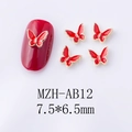 Macro view of 7.5x6.5mm red alloy butterfly nail charms with golden edges and Mocha finish - Red Gold Edge Large Butterfly Style (AB12)