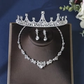 Elegant silver bridal jewelry set with sparkling crystals including crown, necklace, and earrings - Silver Style (ZUHE-011)
