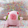 Pink plush capybara keychain with green ribbon bow on soft macaron foam background - Turtle Backpack Pink + Gold Clip