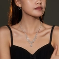 Sparkling water drop rhinestone necklace and earring set on model in black velvet dress - Multi-Layer Branched Fringe Set (DTN14026002S)