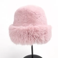 Detailed close-up of a cozy pink faux fur winter bucket hat on a black display stand - M (56-59cm) / Pink