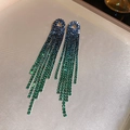 Detail of long tassel earrings with blue and green ombre rhinestones on a beige tray - Oval Hollow Rhinestone Tassel (37#) / Blue Green Gradient