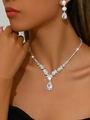 Close-up of sparkling pear-shaped rhinestones on bridal necklace and earrings set - 1544 2-Piece Set / Silver