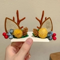 Close-up of reindeer antler hair clips with berries, pinecones and felt ears on card - 20# Yellow Pine Base Style Pair