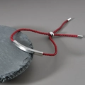 Minimalist red braided rope bracelet with a curved polished silver stainless steel bar - Red Rope Silver