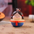 Cute Chinese Tang style girl figurine tumbler in a blue base with traditional red details - Blue Base Roly-poly (1213-9D)