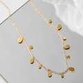 Close-up of golden double-layer snake chain with delicate water drop charms on mirror - Gold Water Drop Sequin Handmade Chain