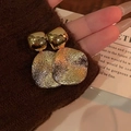 Macro shot of gold square stud earrings with hammer textured geometric metal drops - Hammered Irregular Round Style / Gold