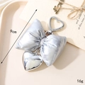 Silver bow heart keychain with metallic pendant and strap on a beige aesthetic background - Leather Heart Bow Pendant / Heart Clasp-Silver