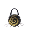 Mini round crossbody bag in black leather featuring a unique gold clock and piano key design - Black