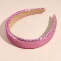 Macro detail of pink sequins on a wide headband with soft beige fabric lining - Rose Red