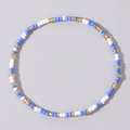 Handmade beaded bracelet with blue white and golden glass seed beads in circular pattern - Blue White Gold