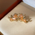 Golden unicorn stud earrings featuring vibrant orange gemstones and white crystal accents - 88# Gold Unicorn Orange Gemstone Studs (Pair)