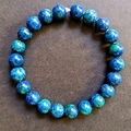 8mm natural blue and green marble texture gemstone bead bracelet on dark background - Green Moss Stone