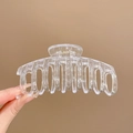 Transparent acrylic hair claw clip for women shown in a hand-held view on warm background - 12# Dragon Bone Transparent Acrylic Style