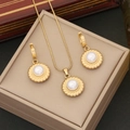 Elegant gold pearl jewelry set with necklace and earrings on beige display case - Necklace and Earrings Set (Gold)