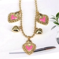 Golden bead chain necklace with pink enamel hearts and polished gold heart pendants - Pink