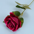 Single deep pink velvet artificial rose flower with green leaves on light blue background - Rose Red