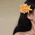 Detail of fabric orange flower and woven starfish hair clips for an elegant summer resort style - Starfish Flower Duckbill Clip / Yellow-Orange