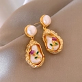 Detailed macro view of baroque pearl earrings with hand-painted purple enamel flowers - Baroque Gold Irregular Purple Floral Pearl (2#)