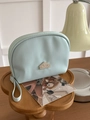 Mini light blue leather semicircular makeup bag with silver logo and carry handle - Teal