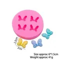 Moule en silicone rose à quatre cavités en nœud papillon avec échantillons de fondant - Modèle 1 / Rose