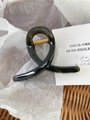 Elegant dark green acrylic claw clip with gold spring on textured background - Linen Green