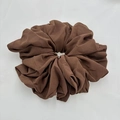 Detailed view of the textured brown chiffon fabric and elastic pleats of the large scrunchie - Brown (6-2)