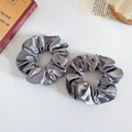 Set of two grey silk satin scrunchies with soft pleated texture and glossy finish - Space Gray
