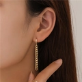 Golden Cuban link drop earrings on model showcasing a modern and minimalist design - Gold Cuban Link Chain Drop Earrings
