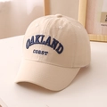 Detail of embroidered OAKLAND coast lettering on a beige cotton baseball cap - 52cm (Recommended 3-8 Years) / Beige