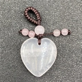 Pink quartz heart pendant featuring a brown braided cord and small decorative beads - Rose Quartz