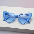 Sky blue heart-shaped sunglasses with gradient blue lenses on white display stand - Blue Frame Gradient Blue Lens