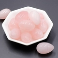 Polished egg-shaped pink quartz stones displayed in a white octagonal tray - Rose Quartz (1pc)