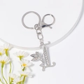 Silberner Schlüsselanhänger Buchstabe L mit Strass und geflügeltem Feen-Anhänger - Stil I / Silber