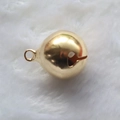 Polished golden spherical bell charm with hanging loop on white faux fur background - Copper / 20mm