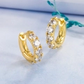 Macro shot of S925 sterling silver stamp on gold plated hoop earrings with white zircon - White