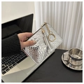 Silver crocodile texture women clutch bag with tassel and keychain in office setting - Silver