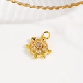 Detailed macro view of 18k gold turtle pendant with sparkling cubic zirconia stones - Clear (Turtle Style B)