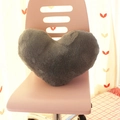 Plush heart-shaped decorative pillow in grey color placed on a pink office chair - Grey Heart