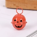 Small orange pumpkin metal bell with cutout face and hanging loop for Halloween decor - 24mm / Painted Orange