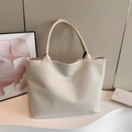 Off-white woven leather tote bag with large capacity and minimalist shoulder strap design - White