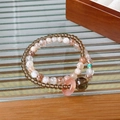 Detail shot of natural crystal beaded bracelets on wooden and striped glass surfaces - 38# Bracelet - Brown - Exquisite Gift Box