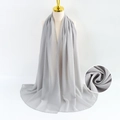 Lightweight grey pearl chiffon scarf displayed on a model with fabric texture detail - Gray