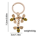 Golden bumble bee pendant keychain with yellow and black enamel finish for bags - Hollow Bee